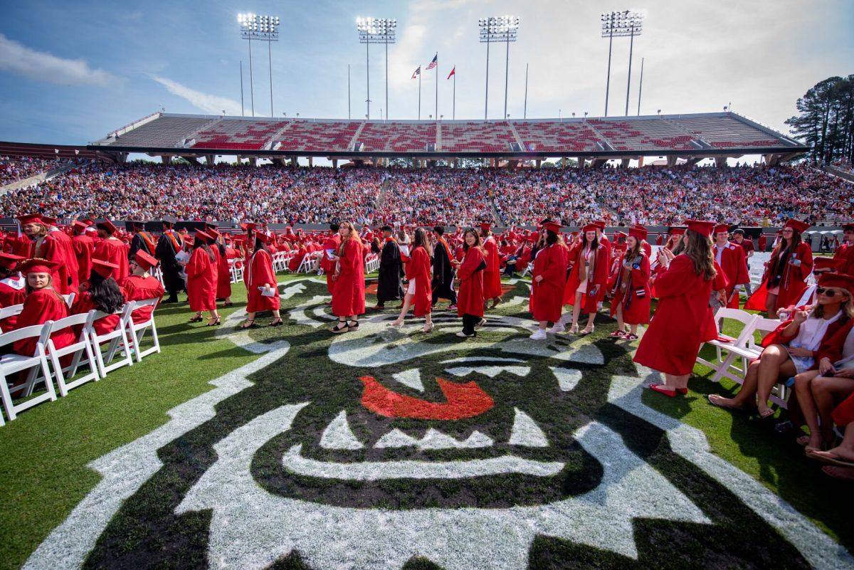 Graduating undergraduate students file into their seats before the University Commencement ceremony in Carter-Finley Stadium on Saturday, May 3, 2025. NC State conferred 7,234 degrees at the ceremony, including 5,079 bachelor&#8217;s, 1,783 master&#8217;s, 306 doctoral, and 66 associate degrees.