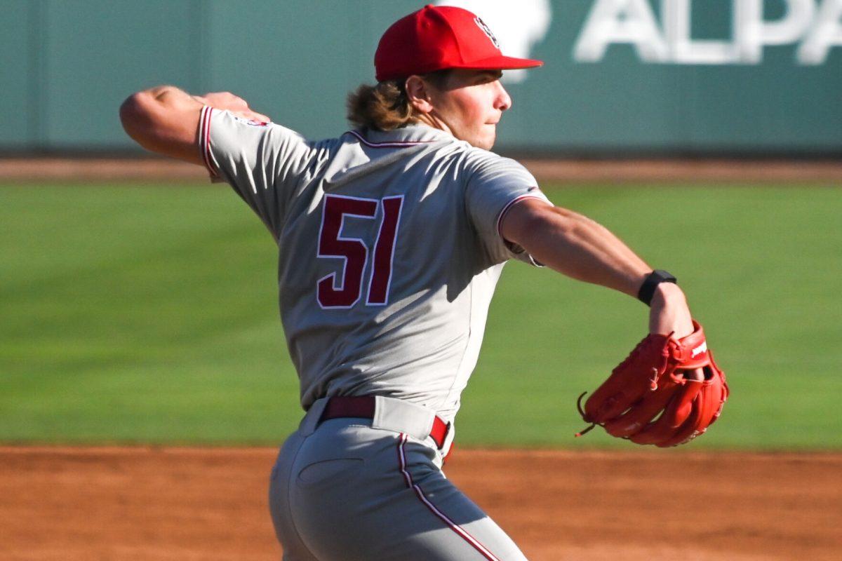 Junior left-handed pitcher Dominic Fritton throws to first during the game against UNC at Boshamer Stadium on Friday, May 9, 2025. Fritton pitched 6.0 innings and tallied seven strikeouts. NC State beat UNC 8-5.