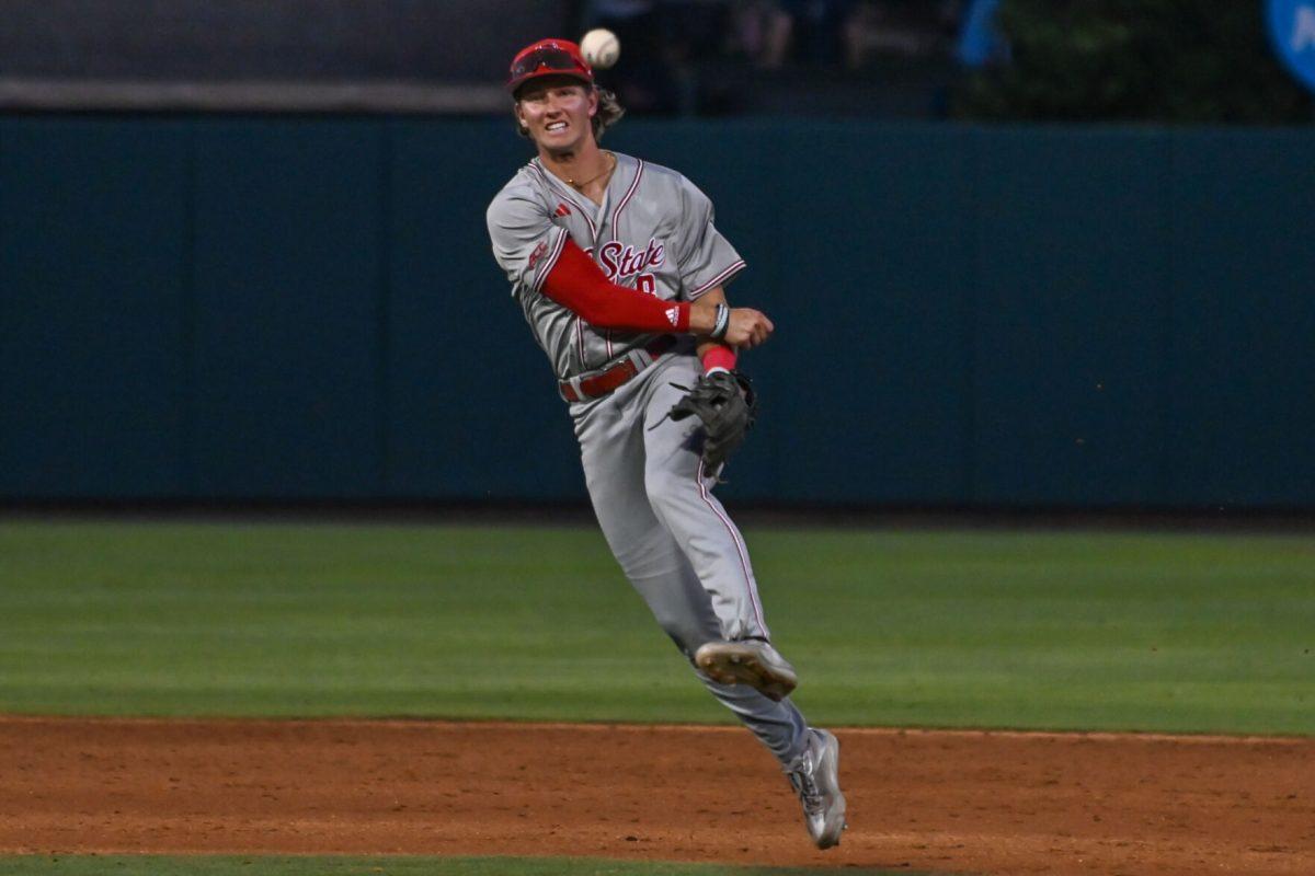 Senior infielder Justin DeCriscio throws to first during the game against UNC at Boshamer Stadium on Friday, May 9, 2025. DeCriscio went one-for-four with a run batted in. NC State beat UNC 8-5.