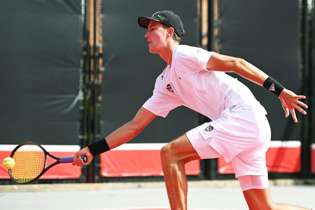 Redshirt freshman William Manning lunges for the ball during the NCAA first round match versus South Carolina State at J.W. Isenhour Tennis Center on Saturday, May 3, 2025. Manning and Van Sambeek won their doubles match 6-0. The Wolfpack beat the Bulldogs 4-0.