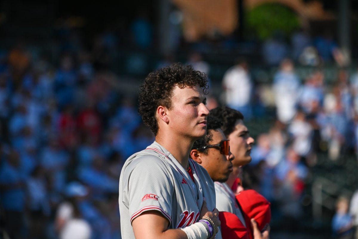 Freshman infielder Brandon Novy stands for the national anthem before the game against UNC at Boshamer Stadium on Friday, May 9, 2025. NC State beat UNC 8-5.
