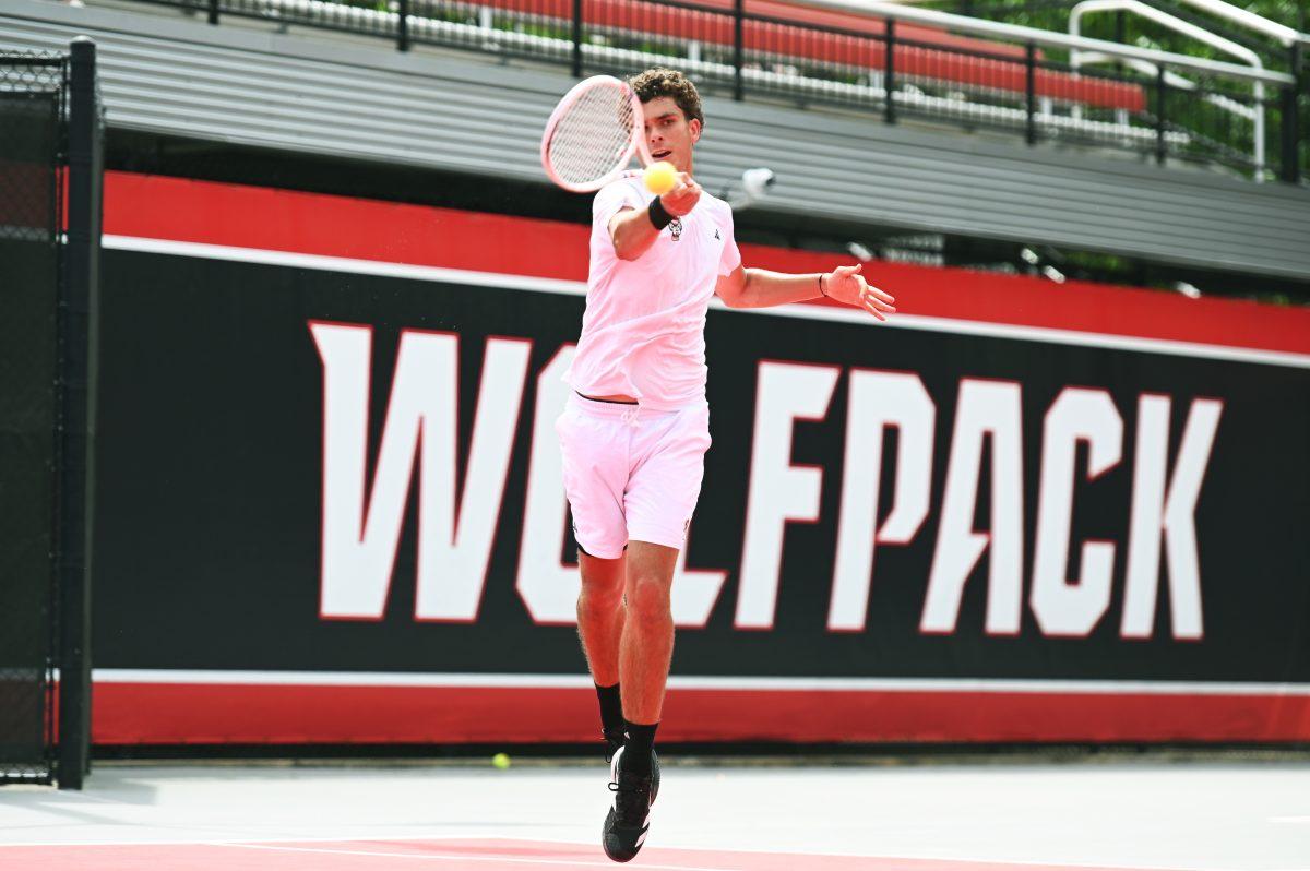 Redshirt freshman Jules Leroux jumps to return the ball during the NCAA first round match versus South Carolina State at J.W. Isenhour Tennis Center on Saturday, May 3, 2025. Leroux won his singles match 2-0 (6-4, 6-2). The Wolfpack beat the Bulldogs 4-0.