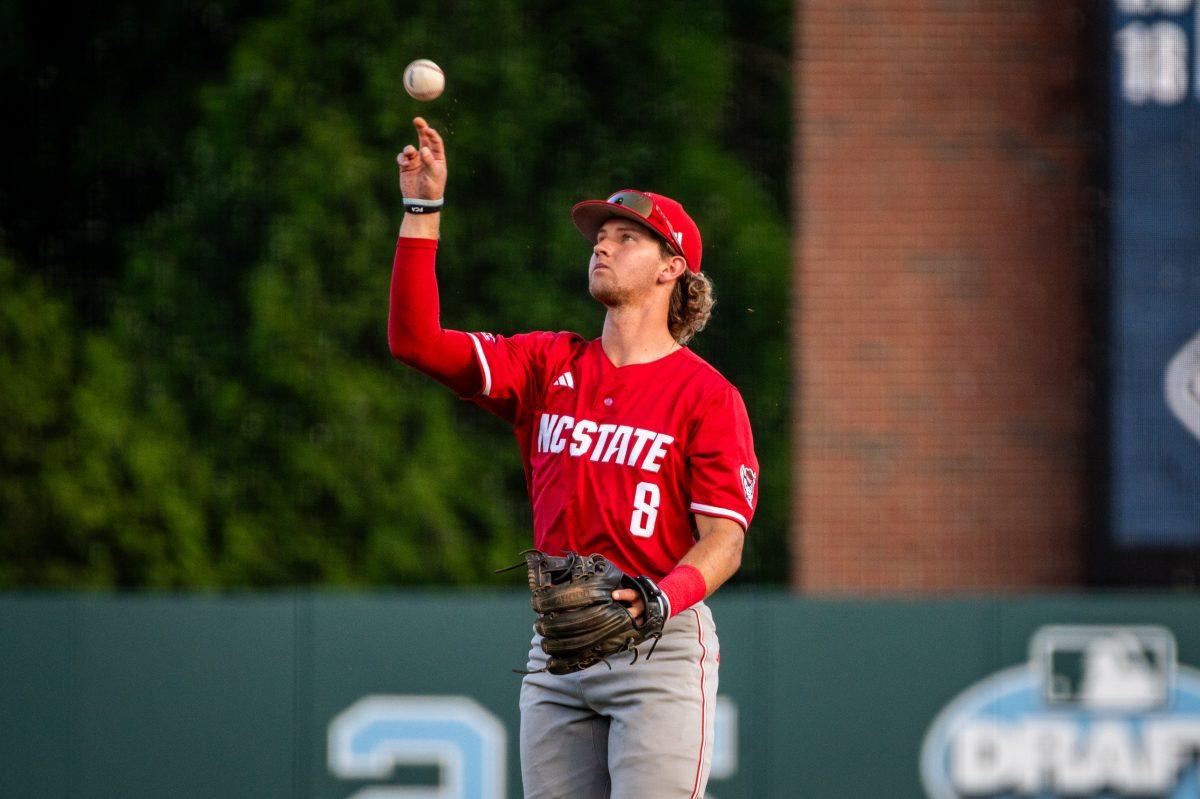 Senior infielder Justin DeCriscio flips the ball into the infield during the game against UNC in Boshamer Stadium on Thursday, May 8, 2025. The Tar Heels beat the Wolfpack 8-1.