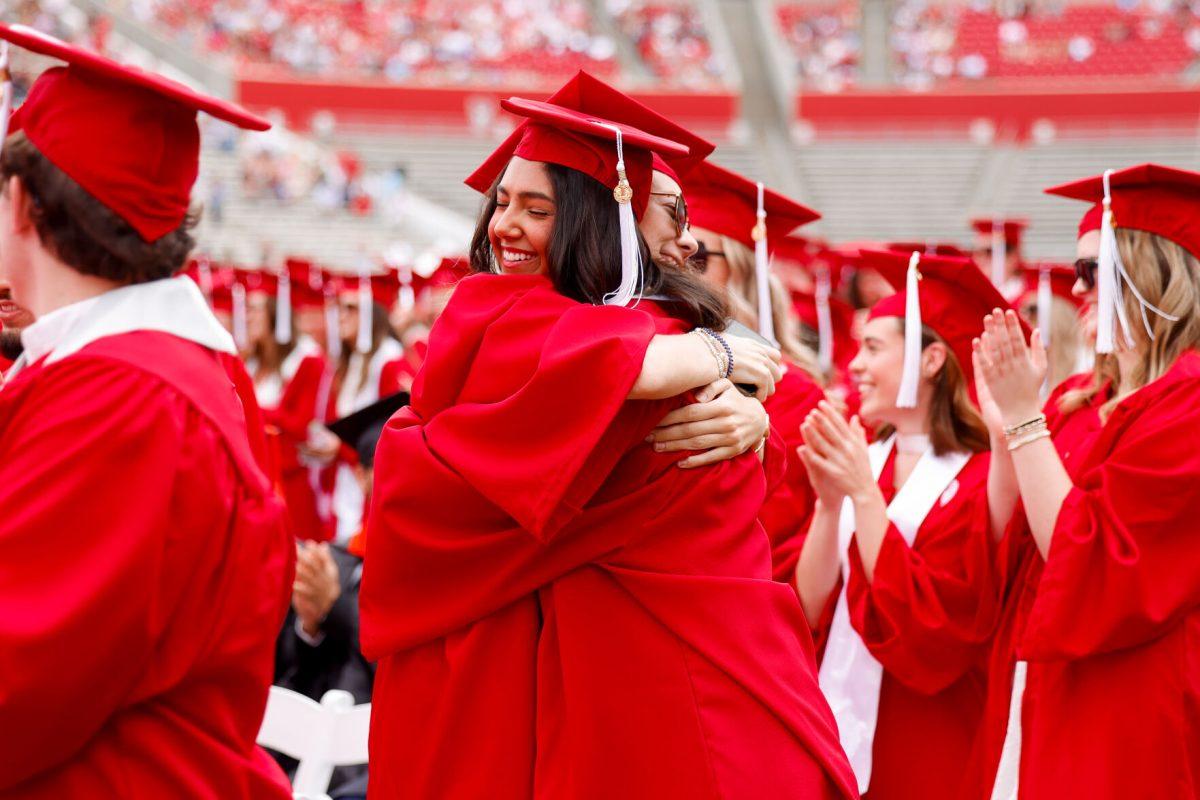 Anisa Barutis, a finance school graduate, and Katie Vick, a finance school graduate, embrace for a hug during the University Commencement ceremony in Carter-Finley Stadium on Saturday, May 3, 2025. Over 306 students graduated with Doctoral degrees at NC States 2025 Spring Commencement Ceremony.