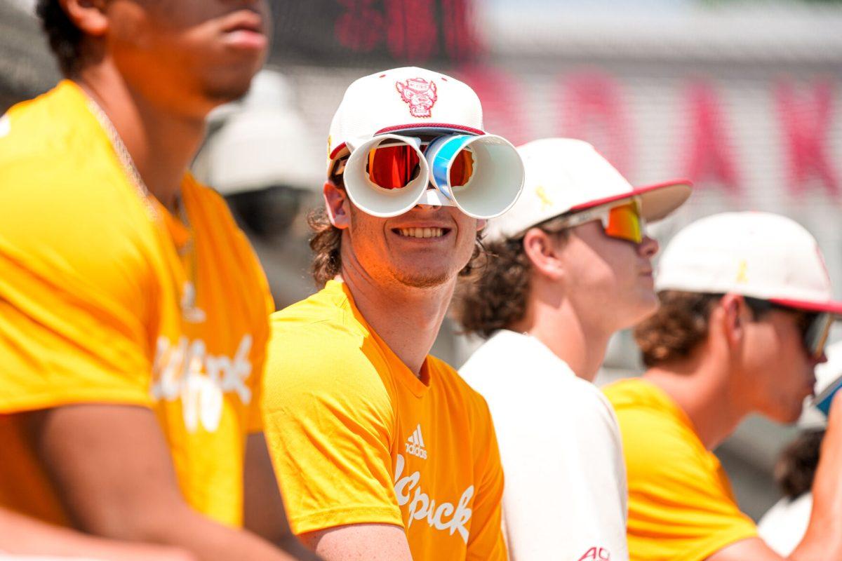 Junior pitcher Andrew Shaffner smiles while wearing powerade cup binoculars during the 2nd annual "Victory over Cancer" game at Doak Field at Dail Park on Sunday, April, 27, 2025. Shaffner has 6 saves so far this season. NC State beat Clemson 4-1.