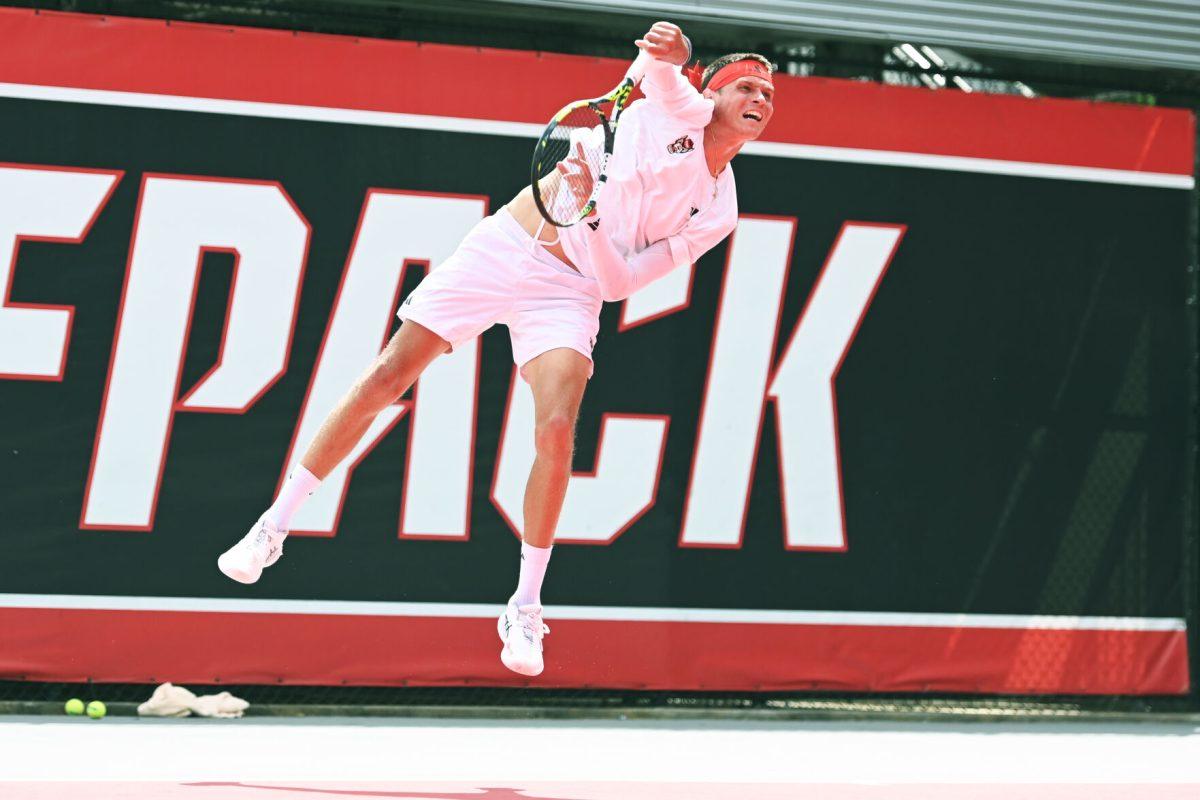Freshman Nikolay Nedelchev serves the ball during the NCAA first round match versus South Carolina State at J.W. Isenhour Tennis Center on Saturday, May 3, 2025. Borisiouk and Nedelchev won their doubles match 6-1. Nedelchev won his singles match 2-0 (6-1, 6-2). The Wolfpack beat the Bulldogs 4-0.