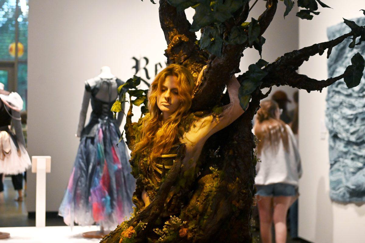 Bailey Lawson, a second-year studying graphic and experience design, models “The Return Home” by Mia Danford-Klein during the Art2Wear: Revive! show at the Gregg Museum of Art and Design on Thursday, April 24, 2025. “The Return Home” is a tribute to the cycle of life, death, and rebirth, and explores the balance between life’s fragility and strength using elements of nature.