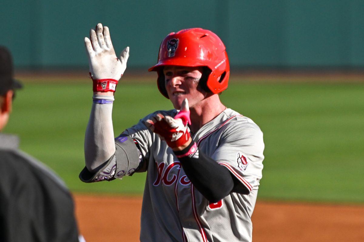 Sophomore infielder Luke Nixon celebrates after reaching first during the game against UNC at Boshamer Stadium on Friday, May 9, 2025. Nixon scored two runs. NC State beat UNC 8-5.