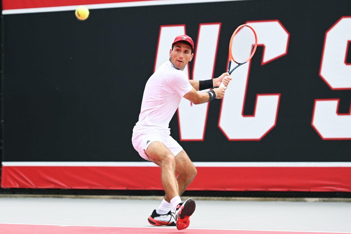 Senior Luca Staeheli watches the ball during the NCAA first round match versus South Carolina State at J.W. Isenhour Tennis Center on Saturday, May 3, 2025. Staeheli won his singles match 2-0 (6-1, 6-1). The Wolfpack beat the Bulldogs 4-0.